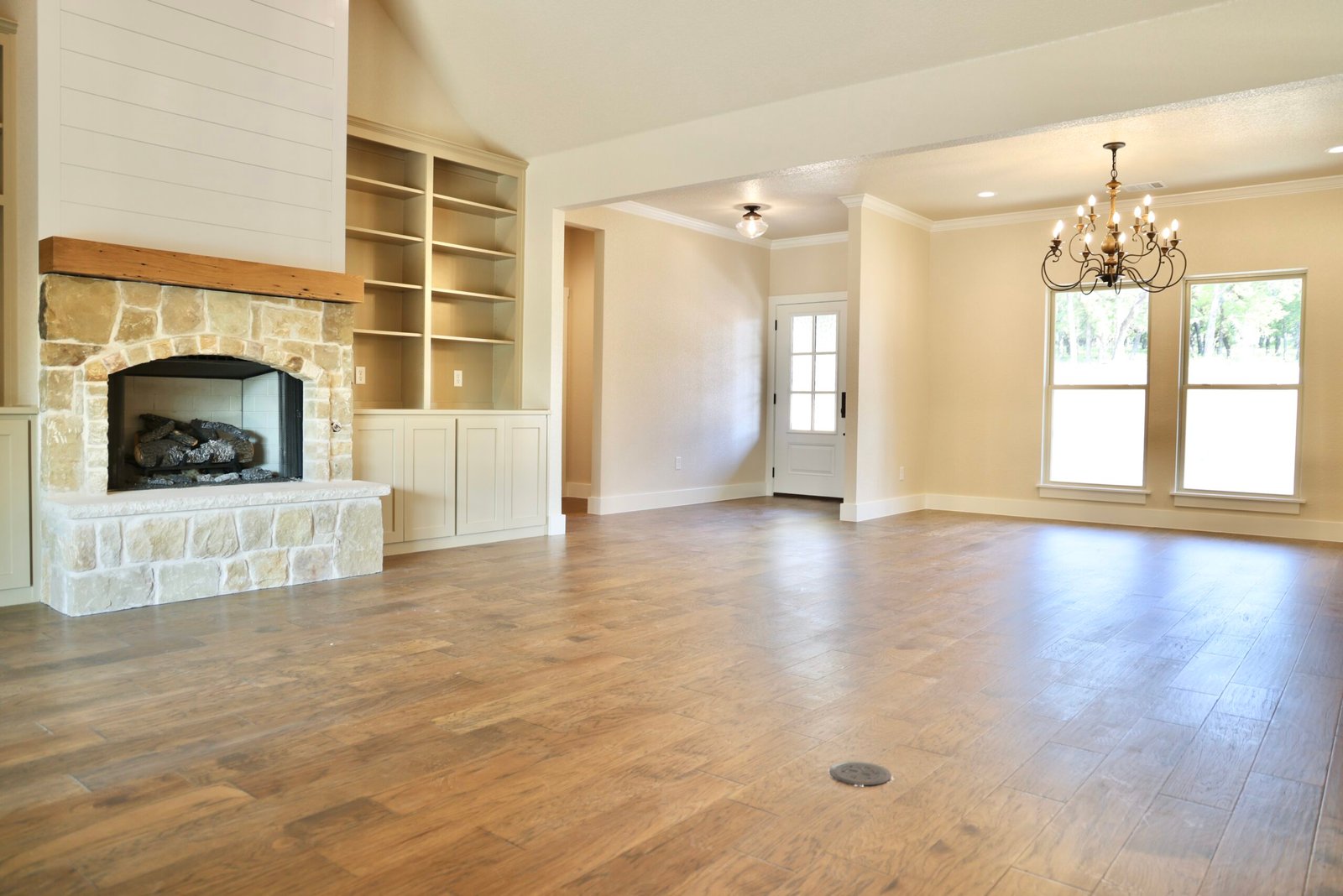 Open living space with hardwood floors and natural light